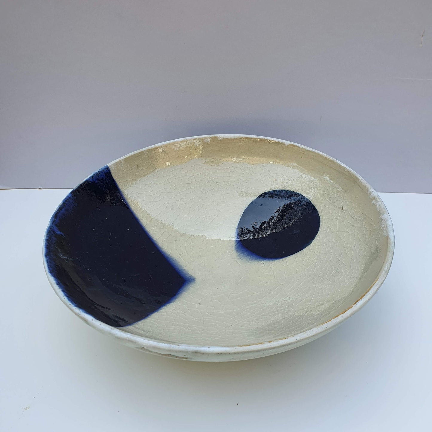 Bowl with blue triangle and circle