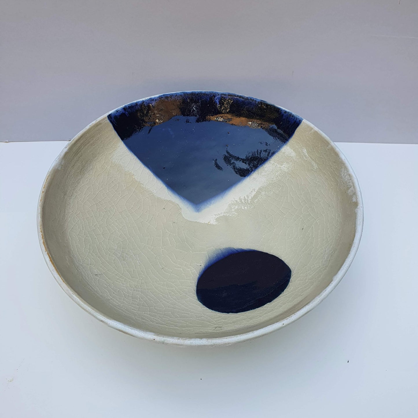 Bowl with blue triangle and circle